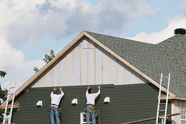Professional Siding Replacement technician working in Freeport, NY